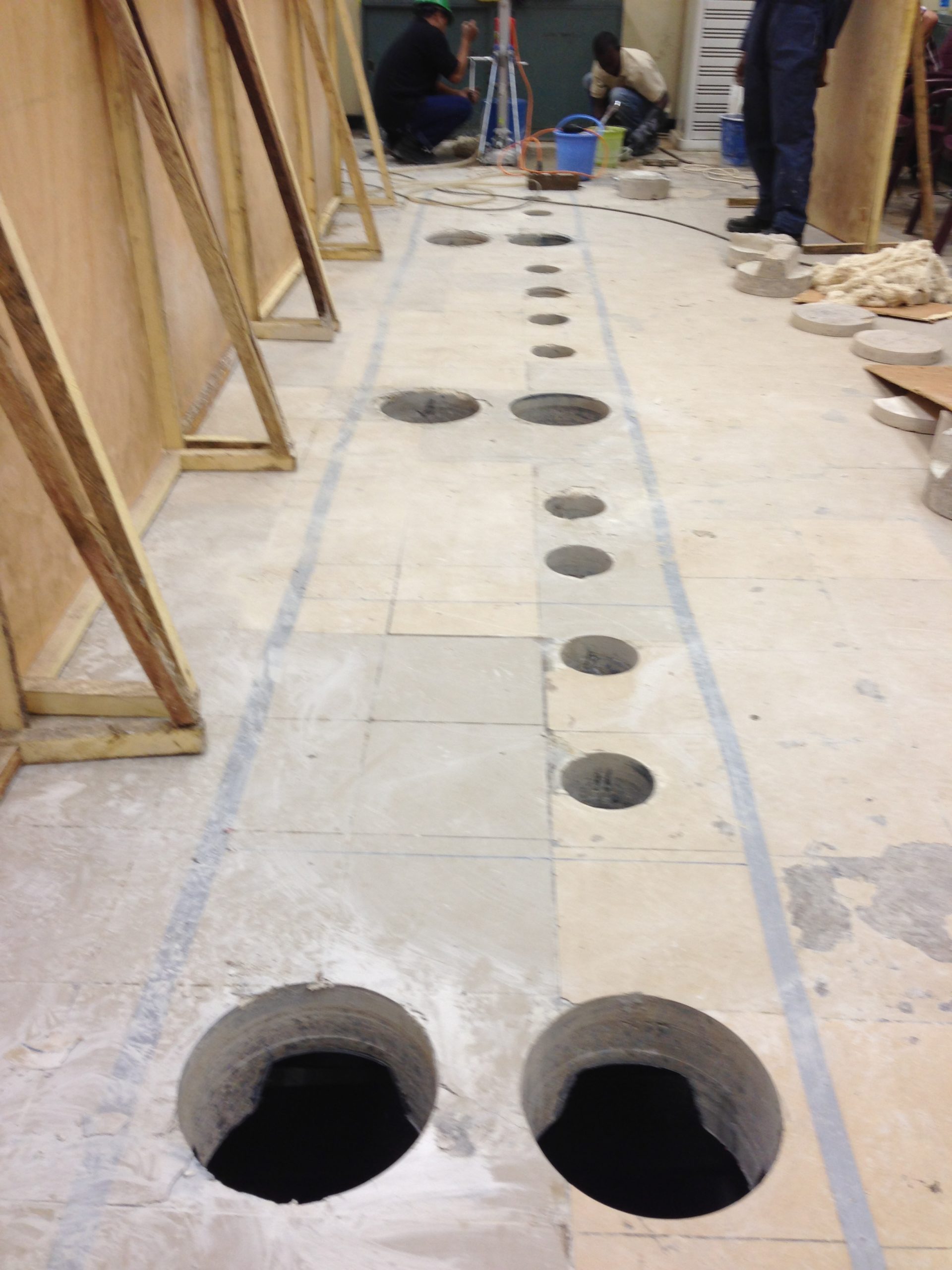 Control room floor installation, core-drilled cable entries